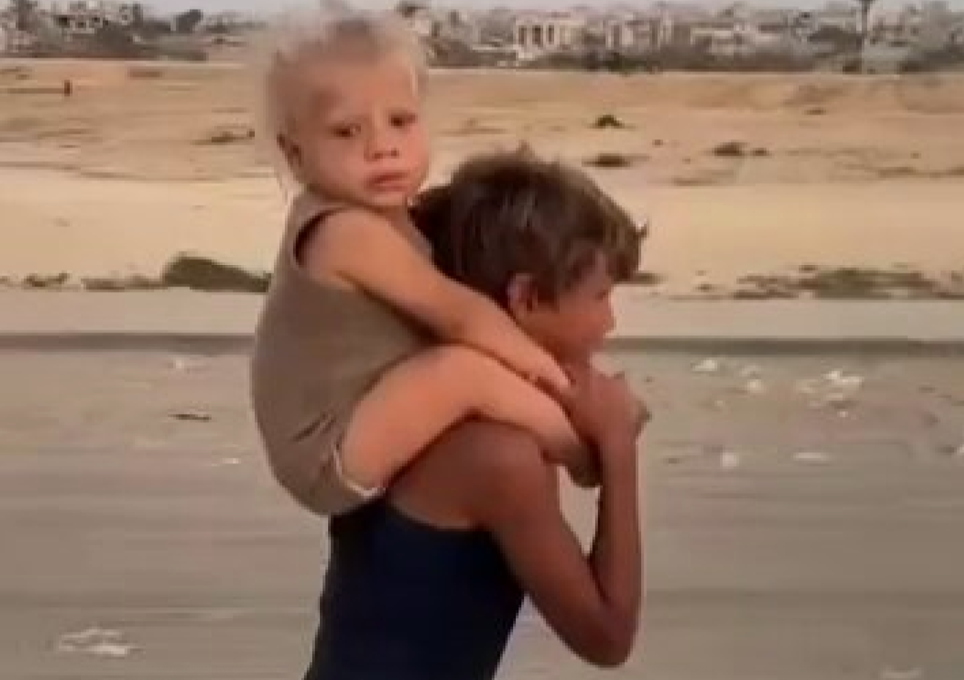 79. Boy carries baby brother [$2000]